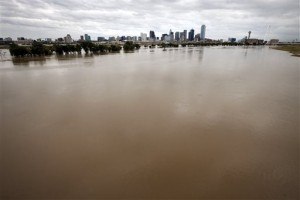 The rain-swollen Trinity River is seen leading up to the city skyline Saturday, Oct. 24, 2015, in Dallas. Southeast Texas was bracing for heavy rain late Saturday and into Sunday as the remnants of Hurricane Patricia combined with a powerful storm system that's been moving across Texas, flooding roads and causing a freight train to derail. (AP Photo/Tony Gutierrez)