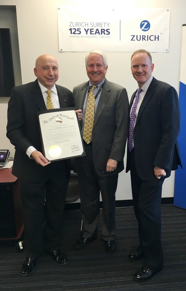 Zurich North America Accepts a proclamation from the State of Maryland in honor of the125th Anniversary of Zurich Surety L to R: Bryan Salvatore, President Specialty Products, Zurich North America, Al Redmer, Jr., Insurance Commissioner of Maryland and Michael Bond, Head of Zurich Surety