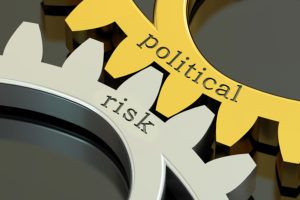 Political Risk concept on the gearwheels 3D rendering