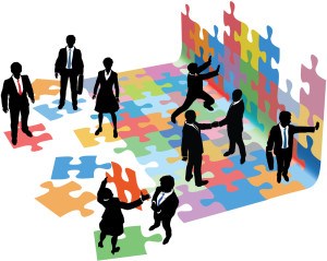 Business people collaborate to put pieces together find solution