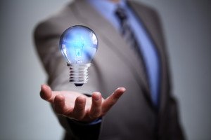 Businessman with illuminated light bulb concept for idea, innova