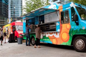 ATLANTA, GA - OCTOBER 2014: Customers order meals from a popular food truck during their lunch hour at "Food Truck Thursday" in Atlanta, GA on October 16, 2014.