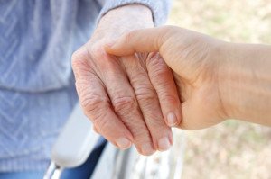 Senior woman's hand and helping hand